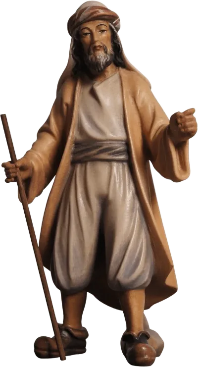 Hand-carved and hand-painted wooden Camel Driver figure holding staff, dressed in beige and brown tones