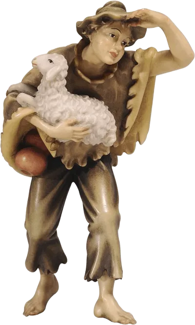 Hand-carved wooden figure of a boy holding a white sheep, wearing a hat and rustic clothing