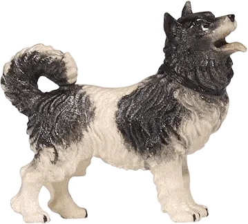 Hand-carved and hand-painted wooden dog figure in black and white, standing with curled tail