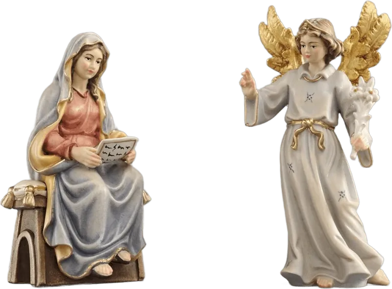 Hand-carved wooden figures of Mary seated with a book and angel Gabriel with golden wings holding lilies