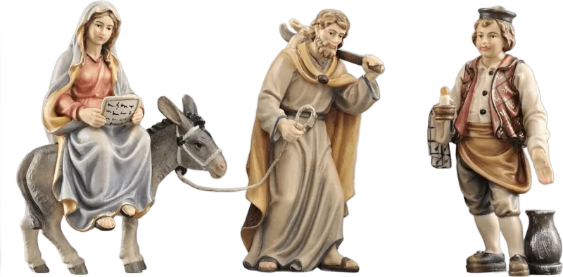 Hand-carved wooden nativity figures showing Mary on donkey, Joseph leading, and boy with candle in traditional painted finish