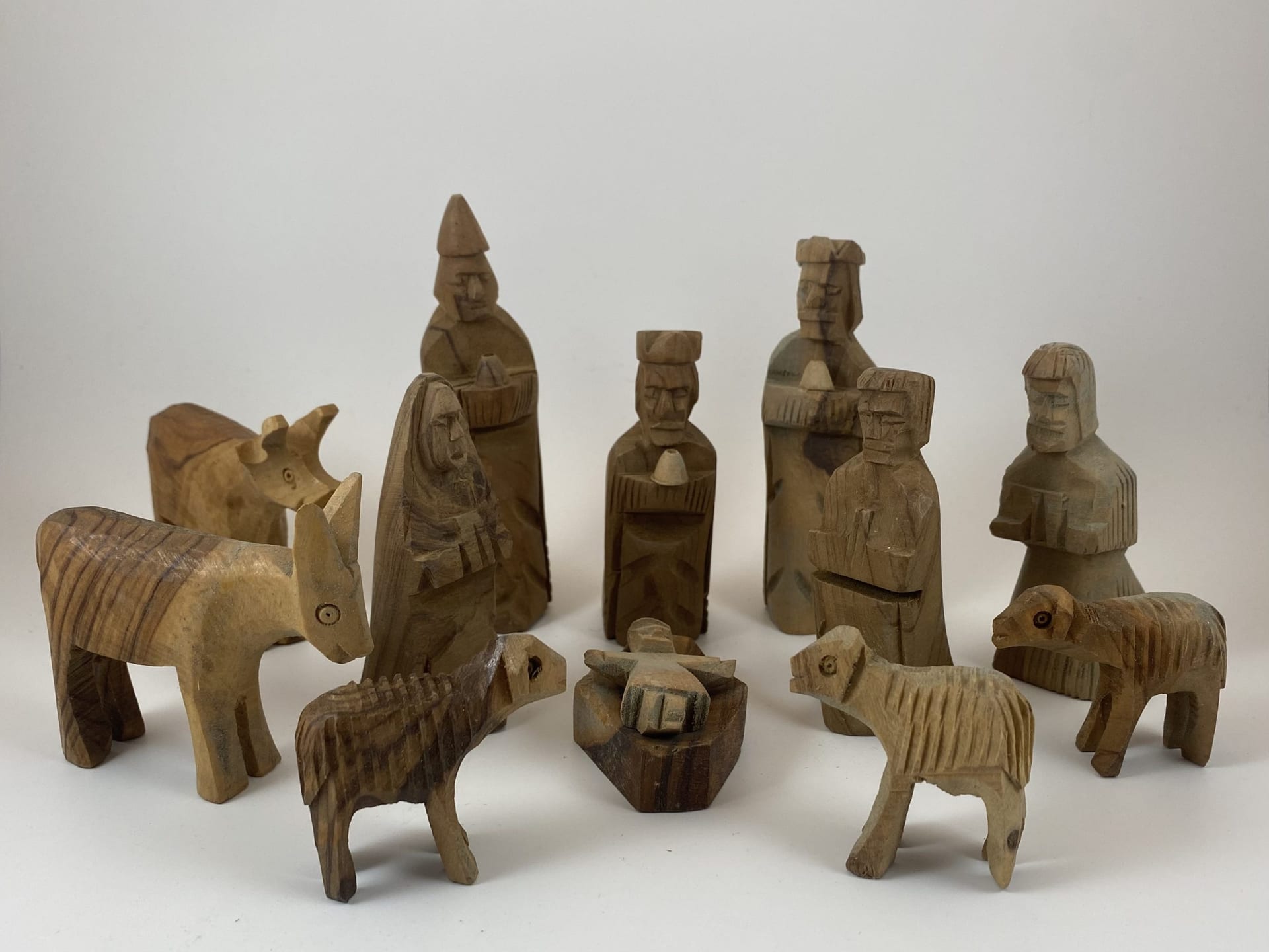 12-piece olive wood nativity set with rustic hand-carved figures including Holy Family, kings, shepherds, and animals