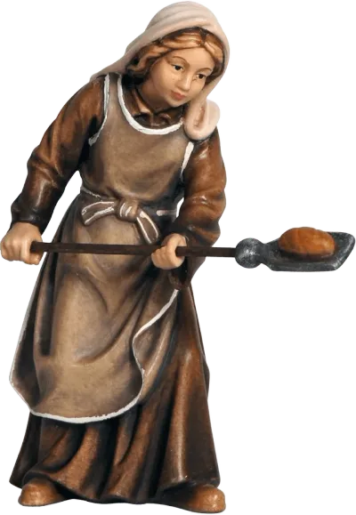 Hand-carved wooden shepherdess figure holding bread on a peel, dressed in brown and beige clothing
