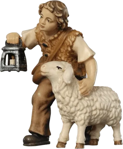 Hand-carved wooden figure of boy holding lantern with sheep, painted in natural tones